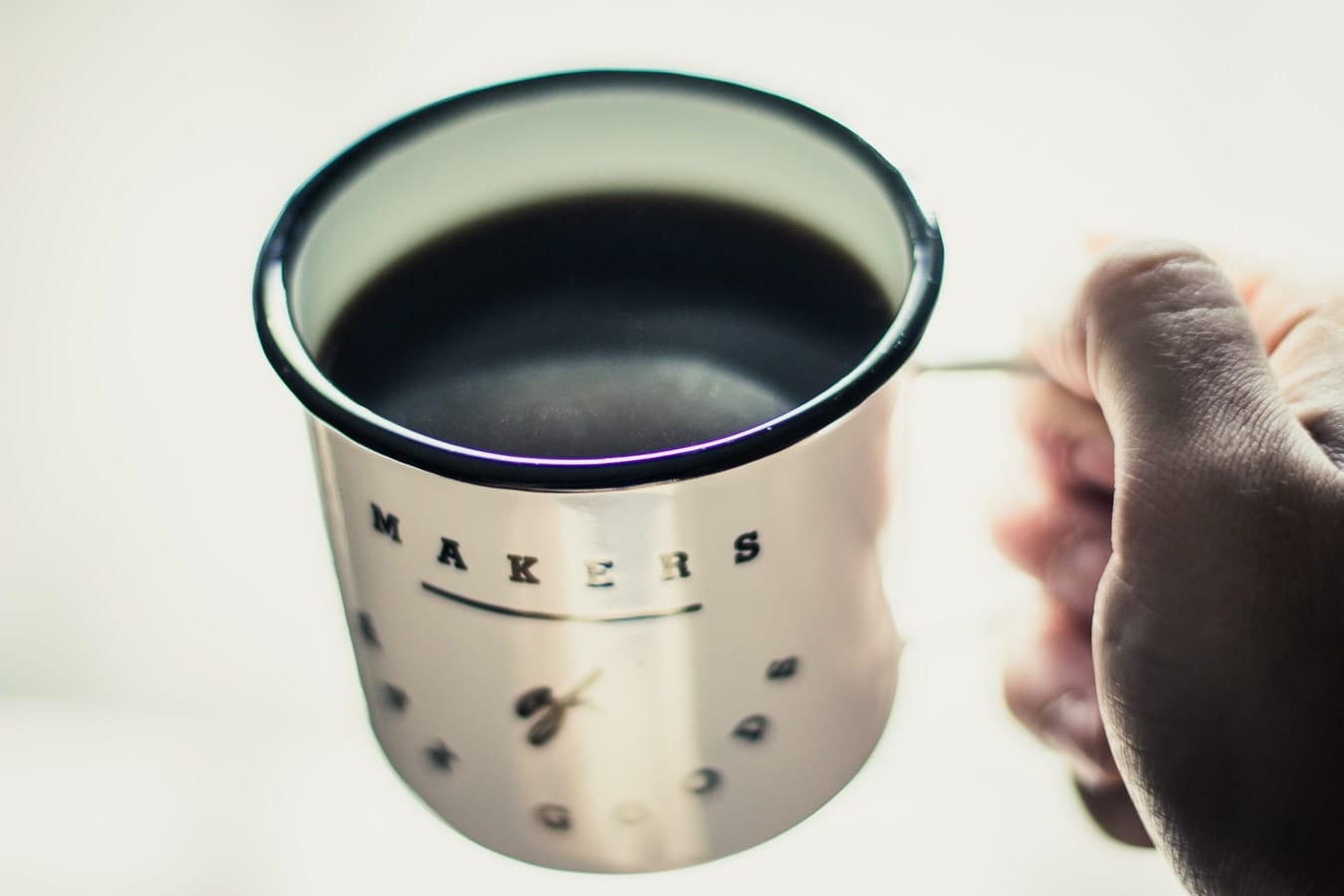 Person holding a cup